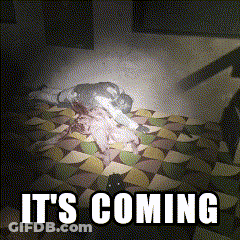 A Picture Of A Person Laying On A Bed With The Words It 'S Coming GIF