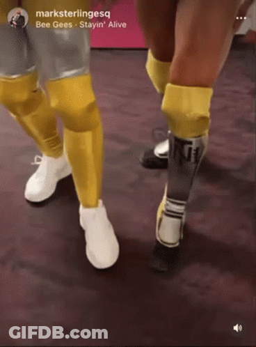 A Picture Of A Person 'S Legs With The Words Bee Gees Stayin ' Alive At The Bottom GIF
