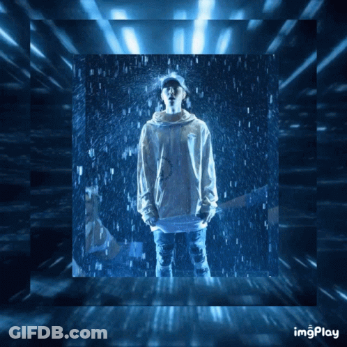 A Picture Of A Person Standing In The Rain With The Words Imgplay Written Below It GIF