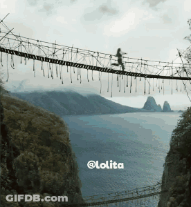 A Picture Of A Person Walking Across A Rope Bridge With The Words @Lolita At The Bottom GIF