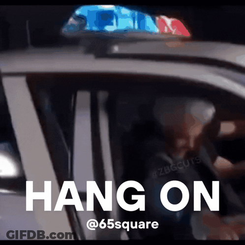 A Picture Of A Police Car With The Words Hang On On The Bottom GIF