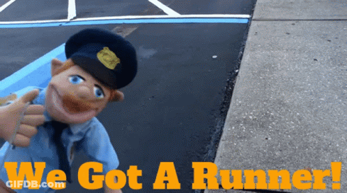 A Picture Of A Police Officer With The Words We Got A Runner Below Him GIF