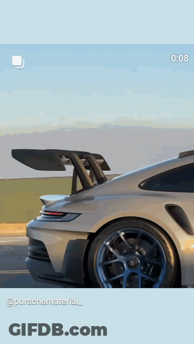 A Picture Of A Porsche Car With A Spoiler On It GIF