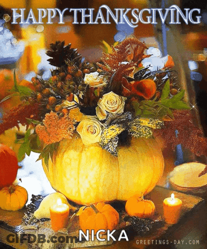 A Picture Of A Pumpkin Filled With Flowers And Candles Says Happy Thanksgiving GIF