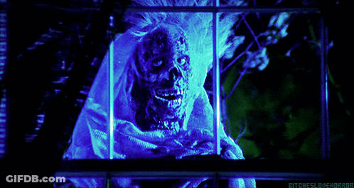 A Picture Of A Skeleton With A Blue Light Behind It That Says Bitcheslovehorror GIF