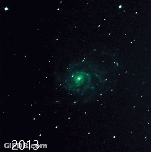 A Picture Of A Spiral Galaxy With The Year 2015 At The Bottom GIF