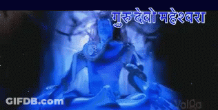 A Picture Of A Statue Of Shiva In A Dark Room With A Blue Light Coming Out Of It GIF