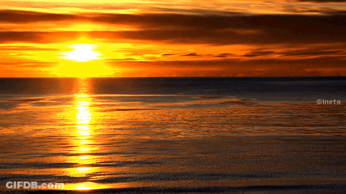 A Picture Of A Sunset Over A Body Of Water With The Watermark Ineta GIF