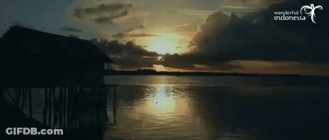 A Picture Of A Sunset Over A Body Of Water With The Words Wonderful Indonesia On The Bottom GIF