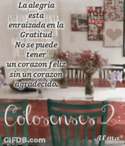 A Picture Of A Table With A Vase Of Flowers And A Quote In Spanish GIF