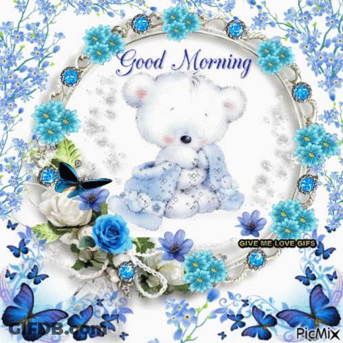 A Picture Of A Teddy Bear Surrounded By Blue Flowers And Butterflies With The Words Good Morning GIF