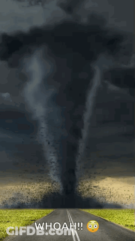 A Picture Of A Tornado Coming Down A Road With The Caption Whoah GIF