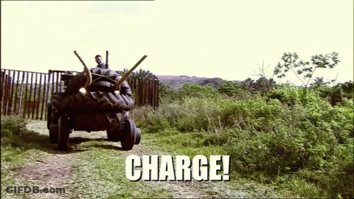 A Picture Of A Tractor With The Word Charge Written On It GIF