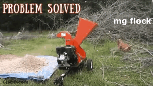 A Picture Of A Tree Chipper With The Words Problem Solved Mg Flock On It GIF
