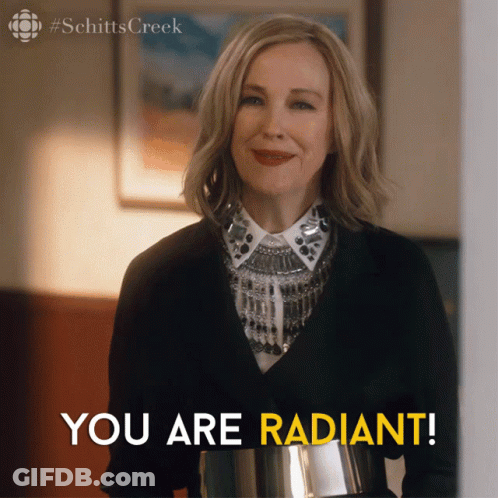 A Picture Of A Woman From Schitt 'S Creek With The Caption You Are Radiant GIF