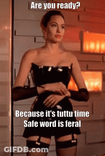 A Picture Of A Woman In A Corset With The Caption " Are You Ready Because It 'S Tutti Time Safe Word Is Feral GIF
