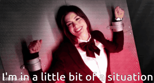 A Picture Of A Woman In A Suit And Bow Tie With The Words I 'M In A Little Bit Of A Situation Behind Her GIF