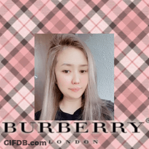 A Picture Of A Woman In Front Of A Pink Burberry London Logo GIF