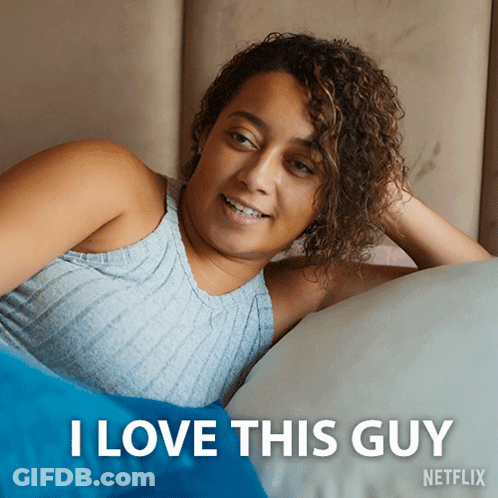 A Picture Of A Woman Laying On A Bed With The Caption I Love This Guy Netflix GIF