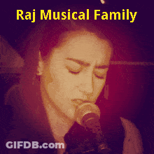 A Picture Of A Woman Singing Into A Microphone With The Words Raj Musical Family So Beautiful Below Her GIF