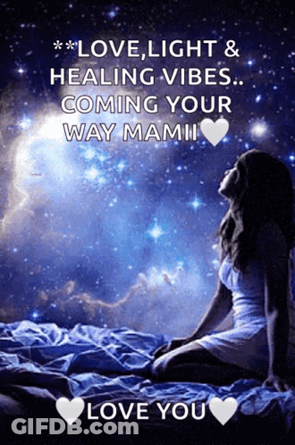 A Picture Of A Woman Sitting On A Bed With The Words " Love Light & Healing Vibes ... Coming Your Way Mami " GIF