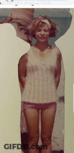 A Picture Of A Woman Standing On A Beach With The Date August 1964 GIF