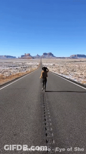 A Picture Of A Woman Walking Down An Empty Road With The Words Bree Rose Eye Of She Below Her GIF