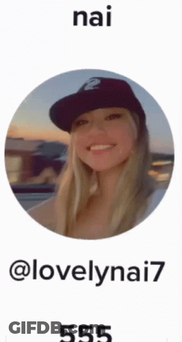A Picture Of A Woman Wearing A Hat With The Name Nai On The Bottom GIF