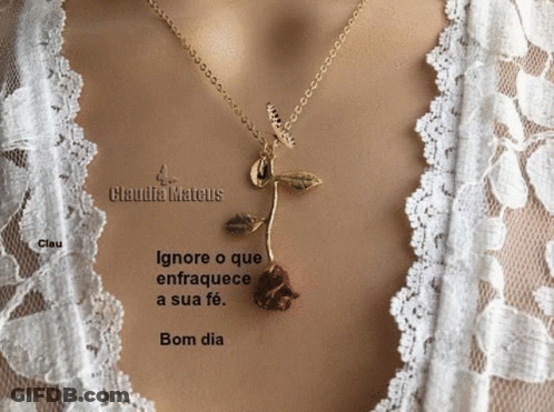 A Picture Of A Woman Wearing A Necklace With A Rose On It GIF