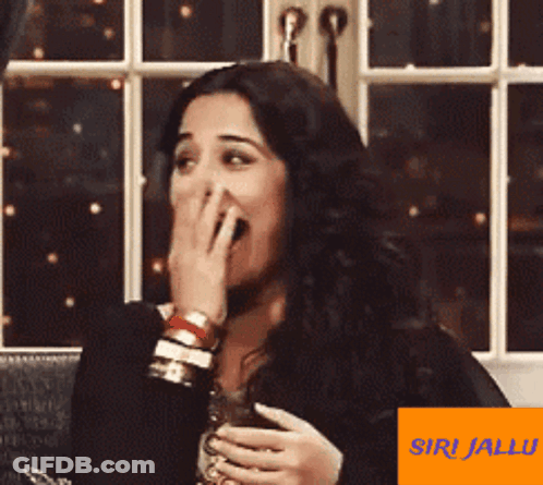 A Picture Of A Woman With An Orange Sticker That Says Siri Jalu On It GIF