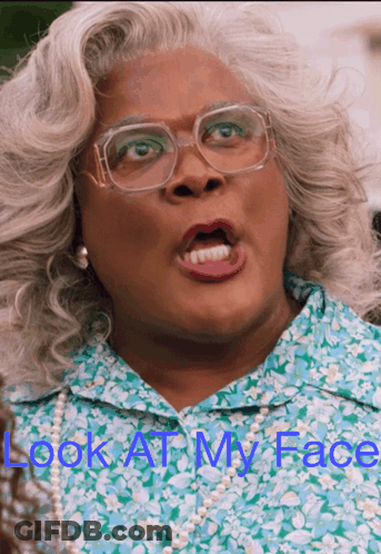 A Picture Of A Woman With Glasses And The Words Look At My Face Above Her GIF