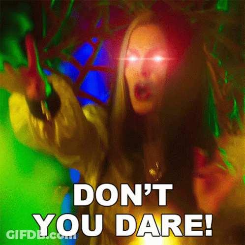 A Picture Of A Woman With Glowing Eyes And The Words " Don 'T You Dare " GIF