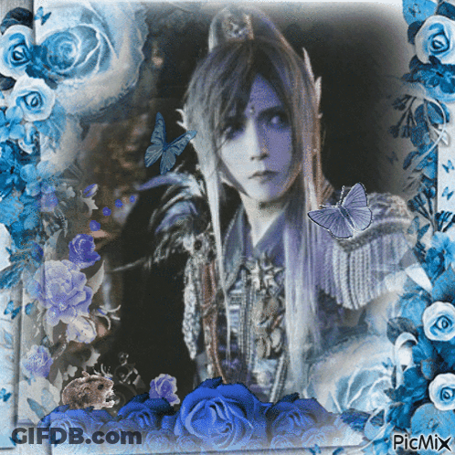 Woman Surrounded By Blue Roses And Butterflies GIF