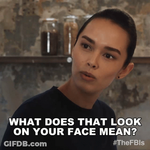 A Picture Of A Woman With The Caption What Does That Look On Your Face Mean GIF