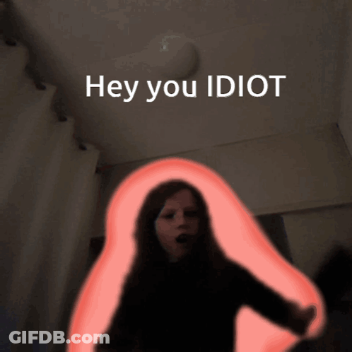 A Picture Of A Woman With The Words Hey You Idiot Written Above Her GIF