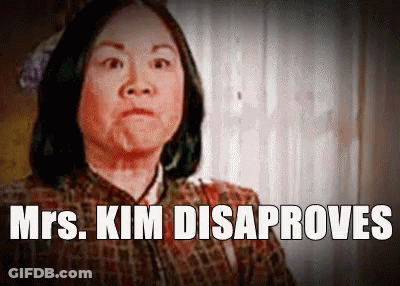 A Picture Of A Woman With The Words Mrs. Kim Disaproves Above Her GIF