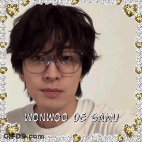A Picture Of A Young Man With Glasses And The Name Wonwoo De Samu On The Bottom GIF