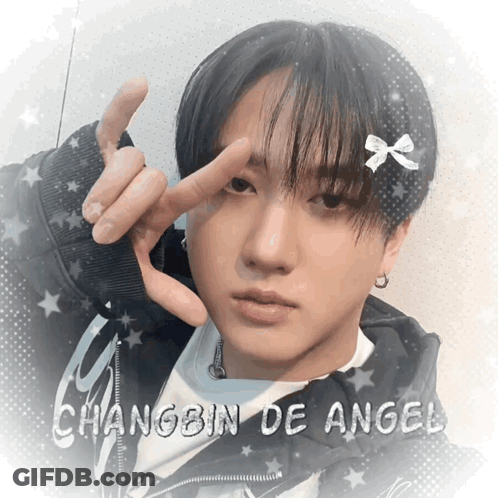 A Picture Of A Young Man With The Name Changbin De Angel On The Bottom GIF