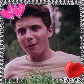 A Picture Of A Young Man With Two Pink Hearts And A Red Heart On The Bottom Right GIF