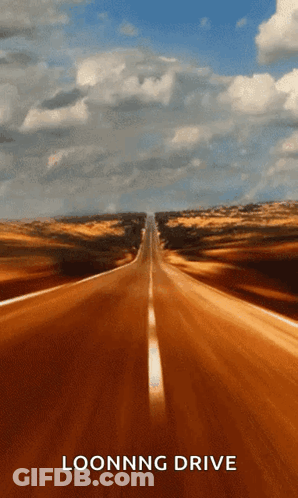 A Picture Of An Empty Road With The Words Loonng Drive On It GIF