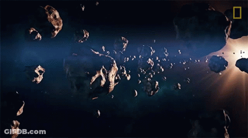A Picture Of Asteroids In Space With A National Geographic Logo In The Upper Left Corner GIF