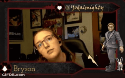 A Picture Of Bryson With A Gremlins Poster Behind Him GIF