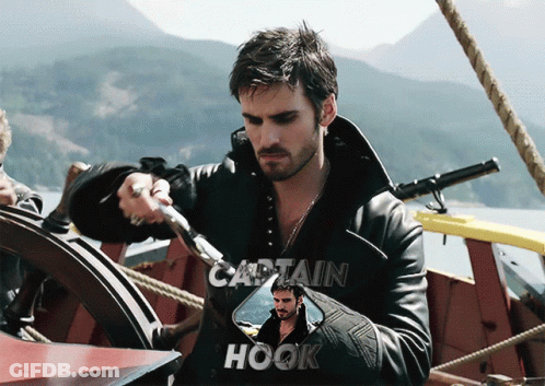 A Picture Of Captain Hook Holding A Sword On A Boat GIF