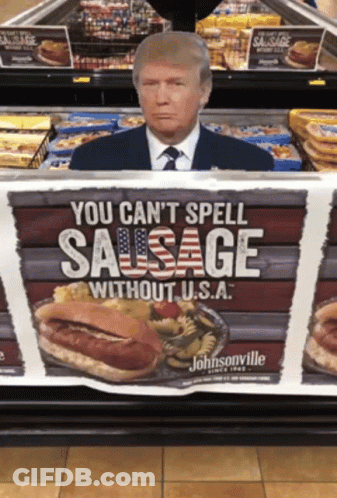 A Picture Of Donald Trump Behind A Sign That Says You Can 'T Spell Sausage Without U.s.a GIF