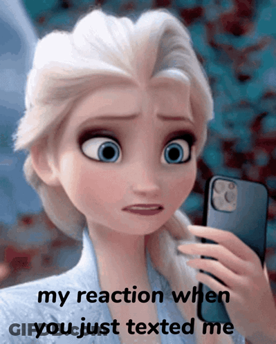 A Picture Of Elsa From Frozen Holding A Cell Phone With The Caption " My Reaction When You Just Texted Me " GIF