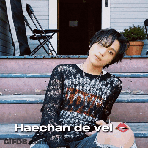 A Picture Of Haechan De Vel Sitting On The Steps GIF