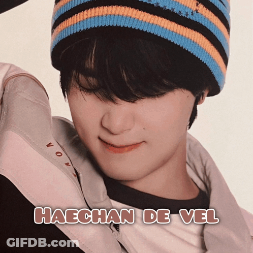 A Picture Of Haechan De Vel With A Striped Hat On GIF