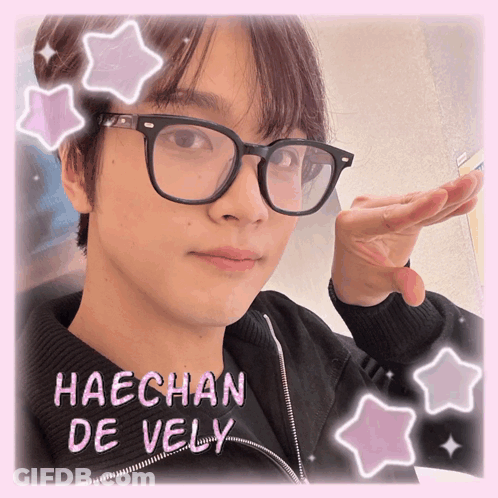 A Picture Of Haechan De Vely With Pink Stars Around His Face GIF