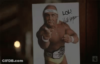 A Picture Of Hulk Hogan Pointing At The Camera With A Signature On It . GIF