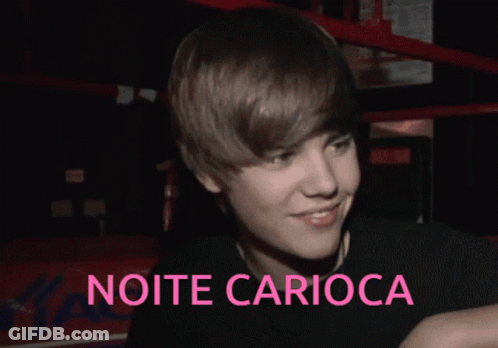 A Picture Of Justin Bieber With The Words Noite Carioca In Pink GIF
